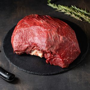 Fresh raw beef meat on black background